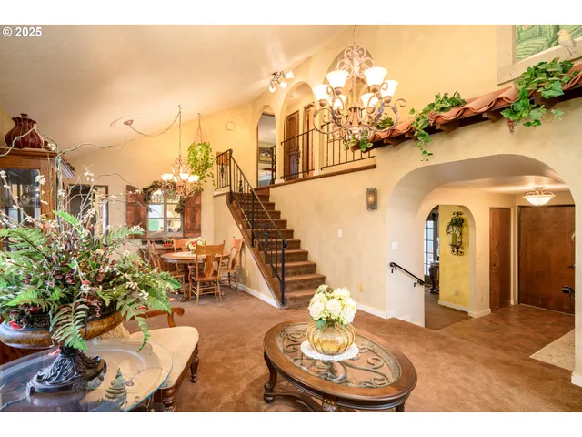 a view of a balcony with dining table and chairs