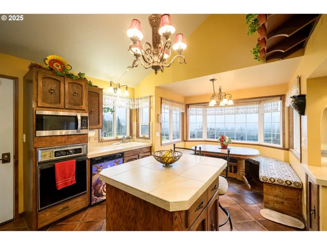 a kitchen with a sink a stove and cabinets