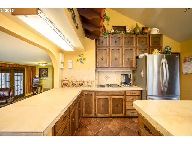 a kitchen with a sink and a refrigerator