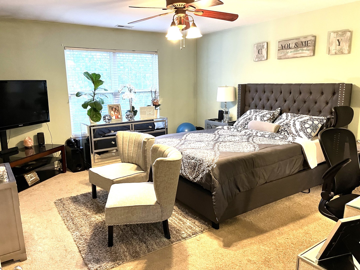 2402 Georgetown Circle Aurora, IL 60503 - Photo 12 of 23 a bedroom with a bed a couch and a flat screen tv