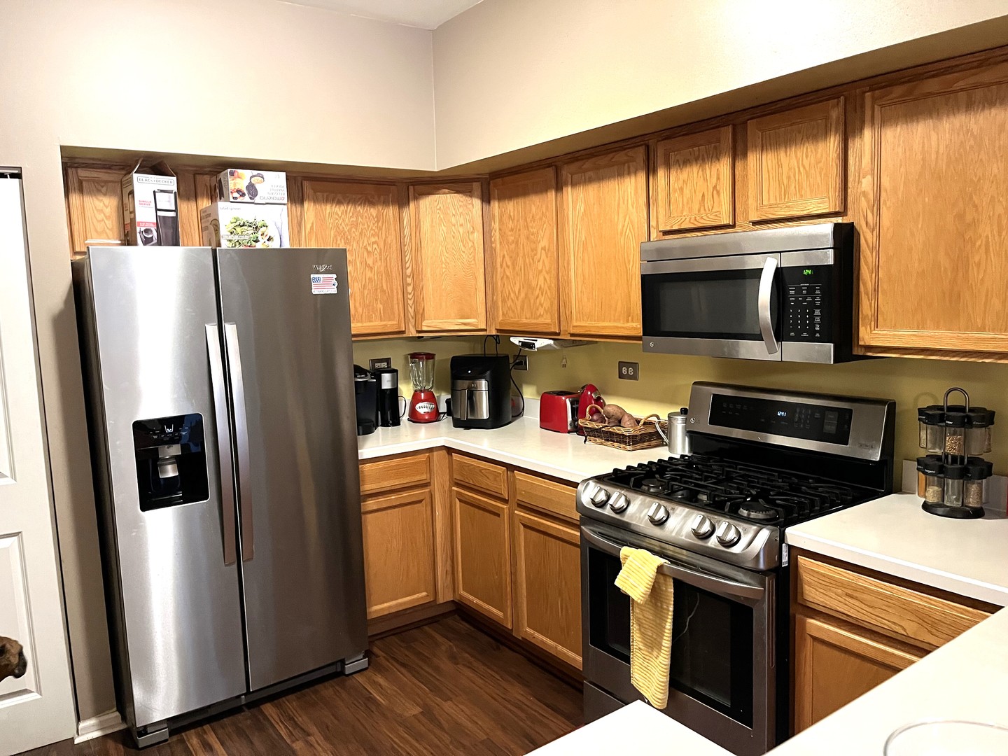 2402 Georgetown Circle Aurora, IL 60503 - Photo 5 of 23 a kitchen with stainless steel appliances granite countertop a stove a refrigerator and a microwave