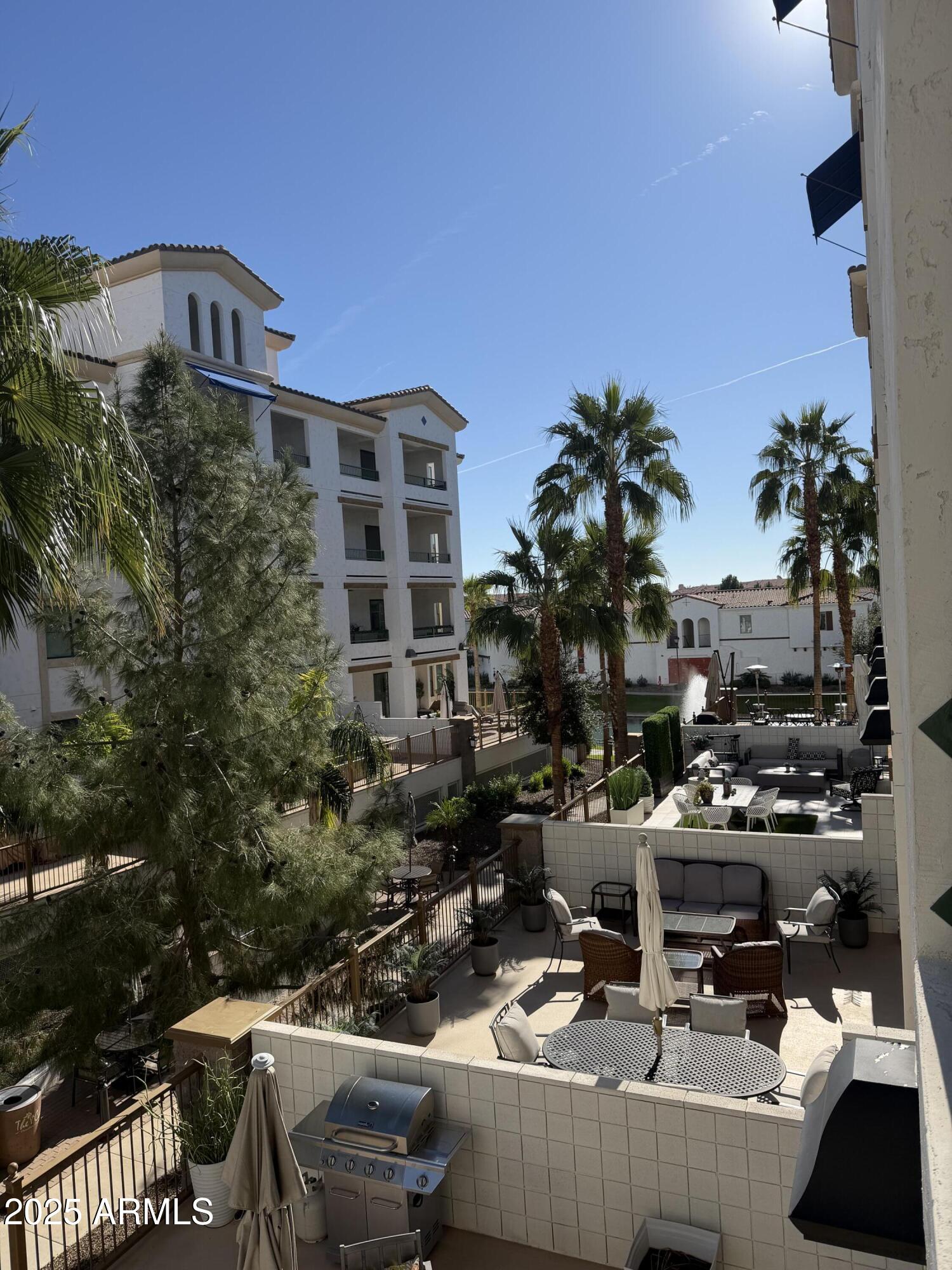 2511 West Queen Creek Road, Unit 223 Chandler, AZ 85248 - Photo 12 of 29 a view of a building from a balcony