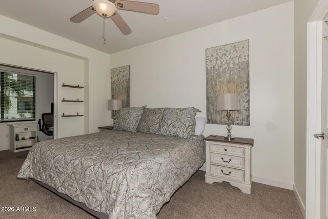 a bathroom with a granite countertop sink mirror and a shower