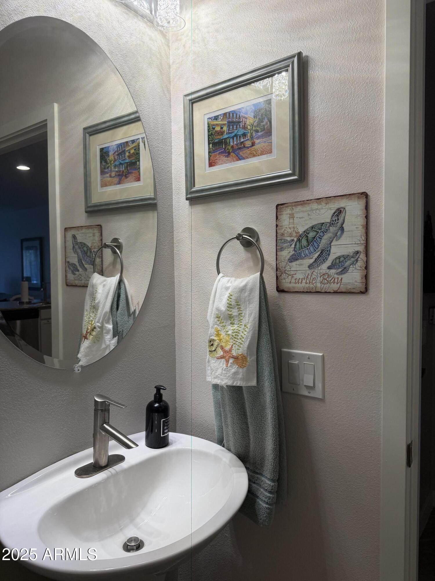 2511 West Queen Creek Road, Unit 223 Chandler, AZ 85248 - Photo 17 of 29 a bathroom with a sink and mirror