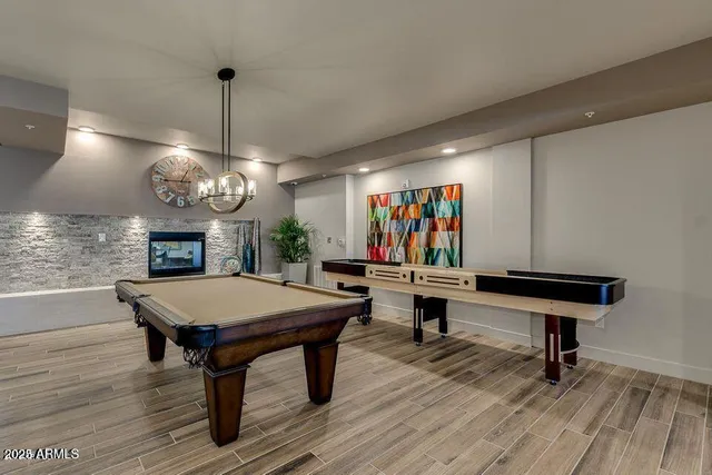 a view of swimming pool with outdoor seating and city view