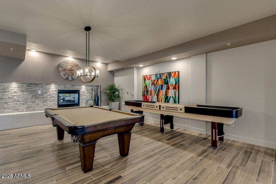 2511 West Queen Creek Road, Unit 223 Chandler, AZ 85248 - Photo 23 of 29 a room with pool table windows and wooden floor