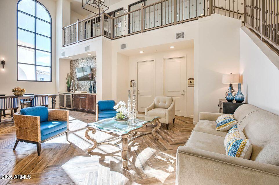 2511 West Queen Creek Road, Unit 223 Chandler, AZ 85248 - Photo 25 of 29 a living room with furniture and a large window