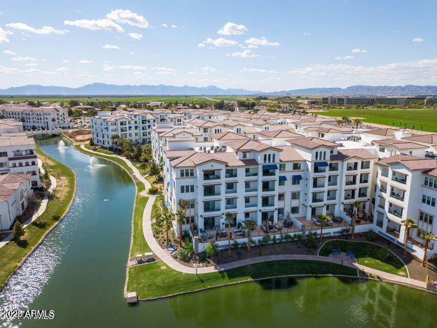 2511 West Queen Creek Road, Unit 223 Chandler, AZ 85248 - Photo 26 of 29 a view of swimming pool with outdoor seating and city view