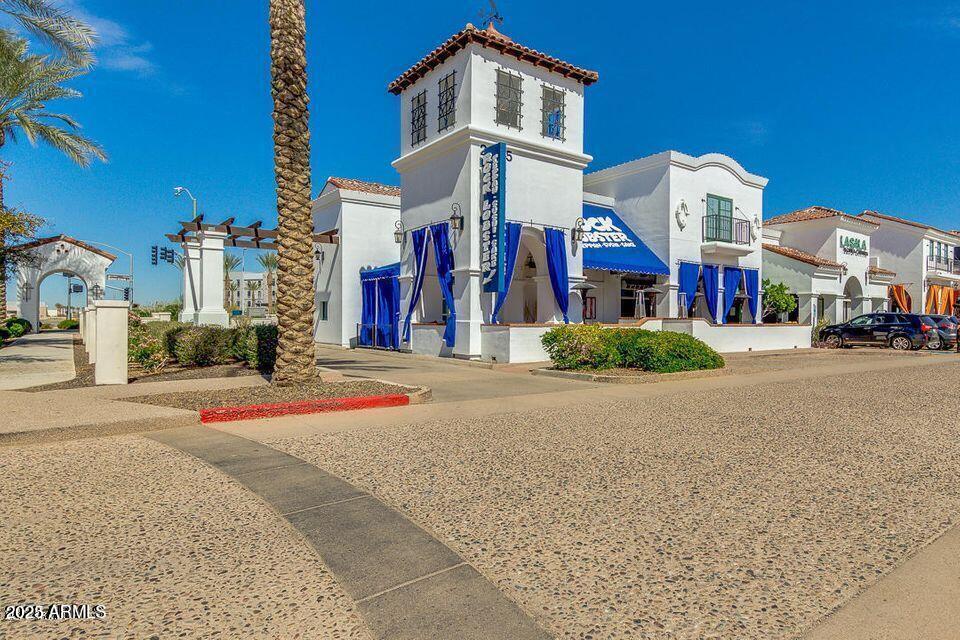 2511 West Queen Creek Road, Unit 223 Chandler, AZ 85248 - Photo 27 of 29 a front view of a building with many windows