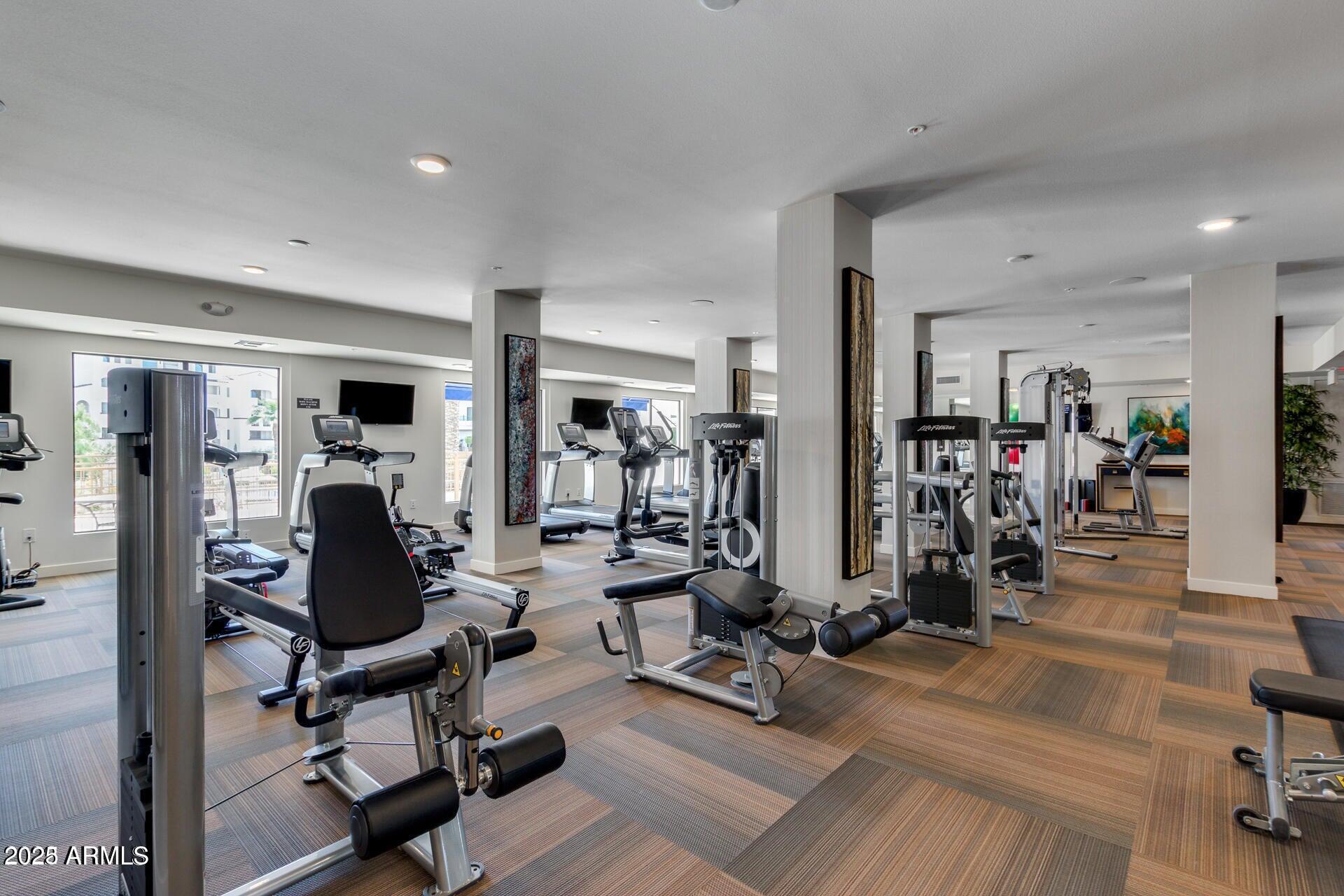 2511 West Queen Creek Road, Unit 223 Chandler, AZ 85248 - Photo 29 of 29 a view of a room with gym equipment