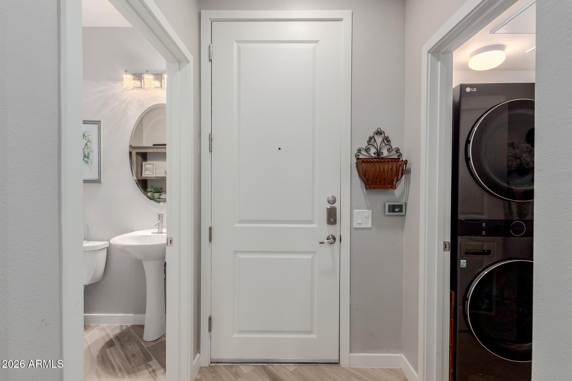 2511 West Queen Creek Road, Unit 223 Chandler, AZ 85248 - Photo 3 of 61 a close view of a utility room with washer and dryer