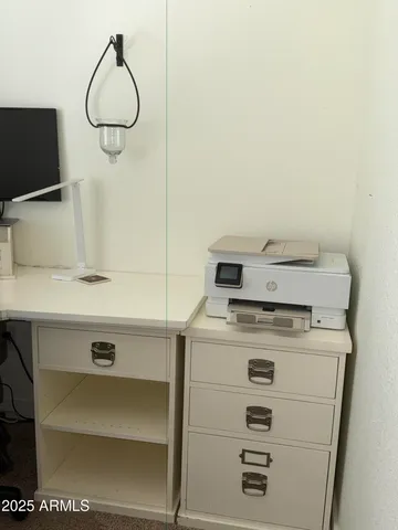 a view of a workspace with furniture