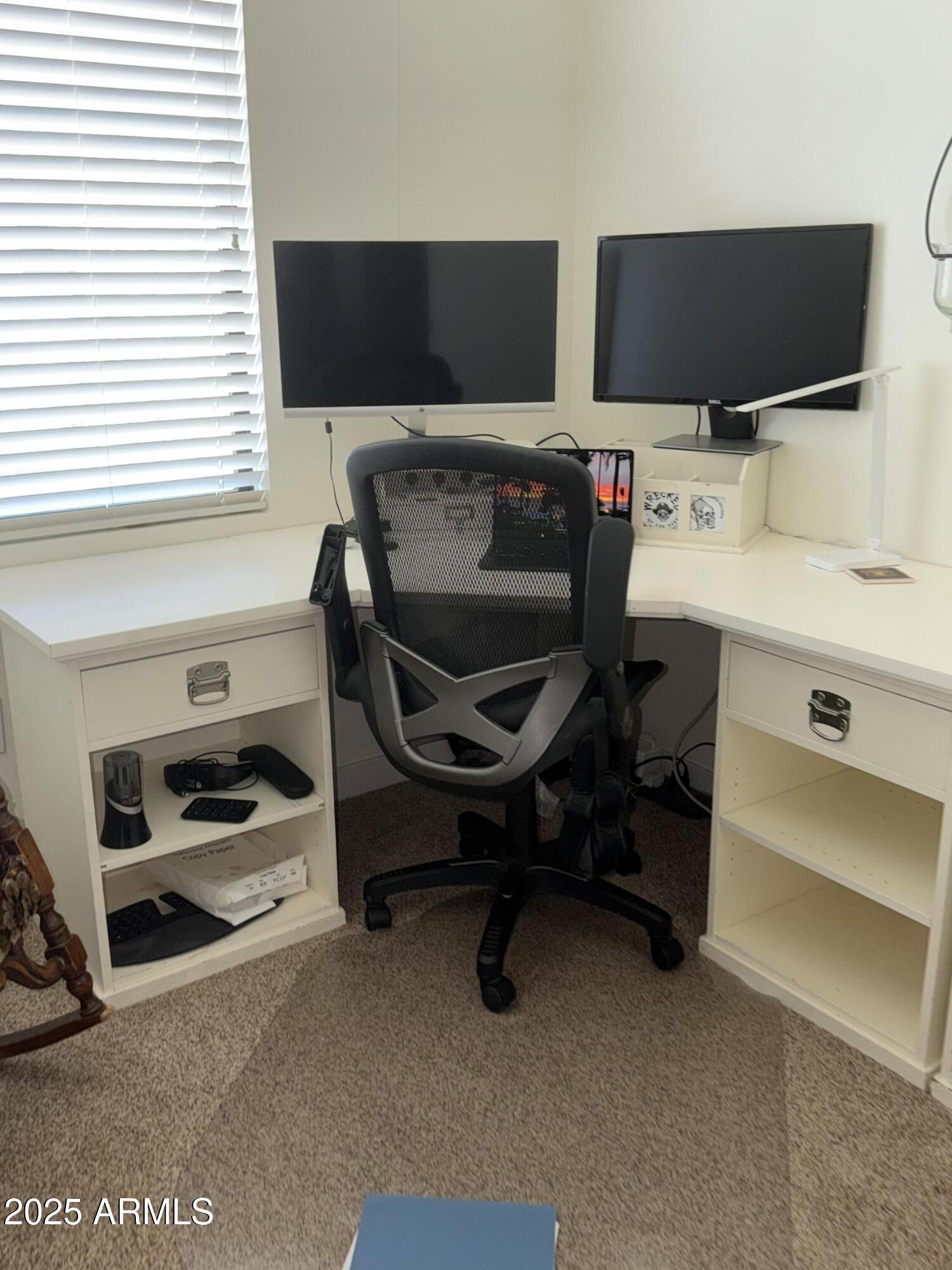 2511 West Queen Creek Road, Unit 223 Chandler, AZ 85248 - Photo 5 of 29 a view of a workspace with furniture