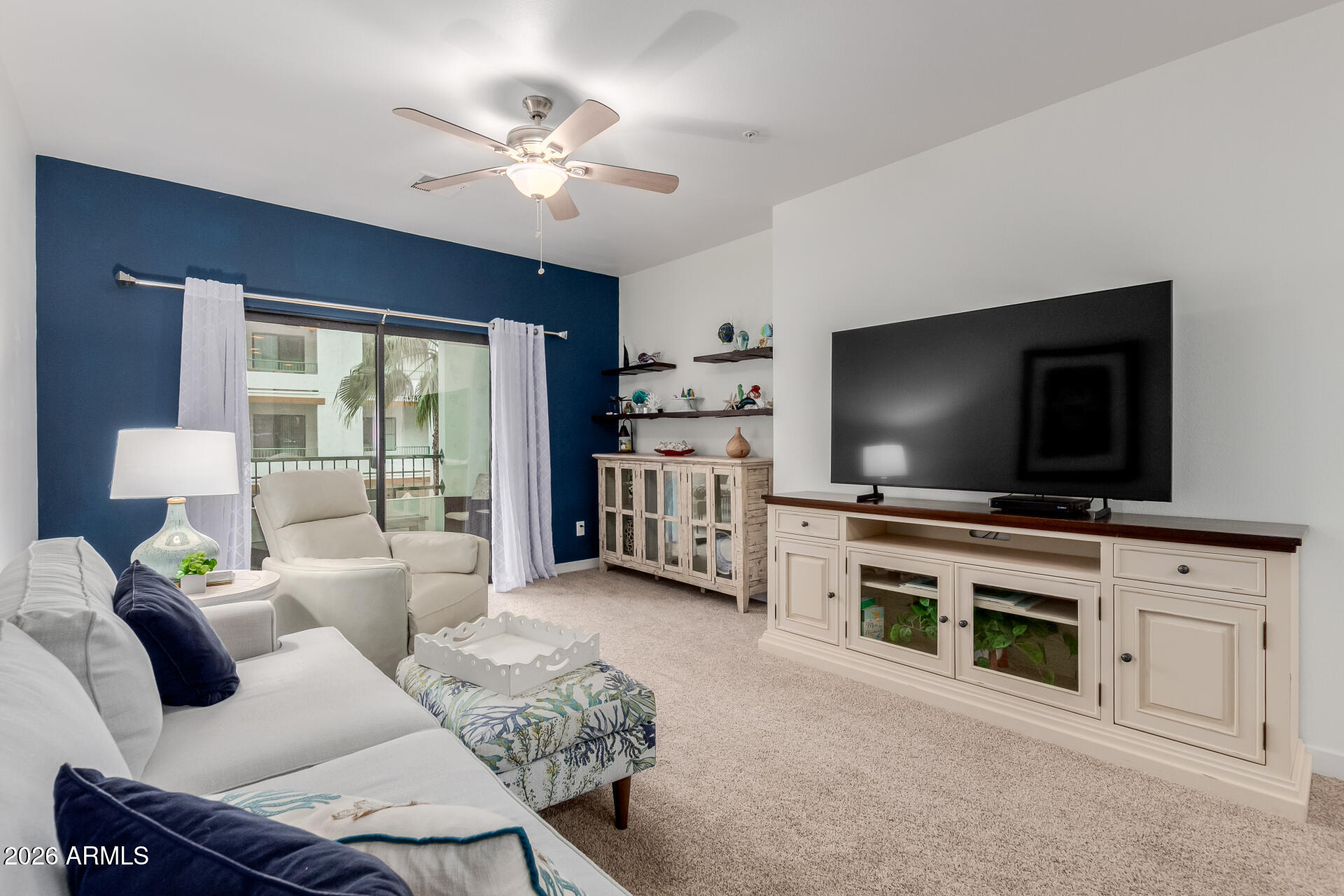 2511 West Queen Creek Road, Unit 223 Chandler, AZ 85248 - Photo 5 of 61 a living room with furniture and a flat screen tv