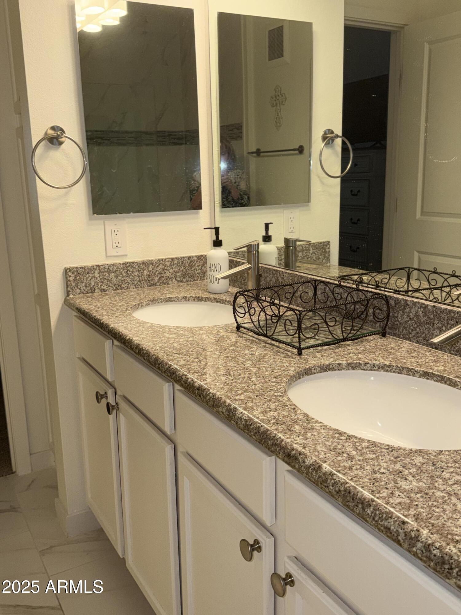 2511 West Queen Creek Road, Unit 223 Chandler, AZ 85248 - Photo 6 of 29 a bathroom with a granite countertop sink and a mirror