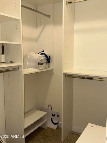 a bathroom with a granite countertop bathtub shower and toilet
