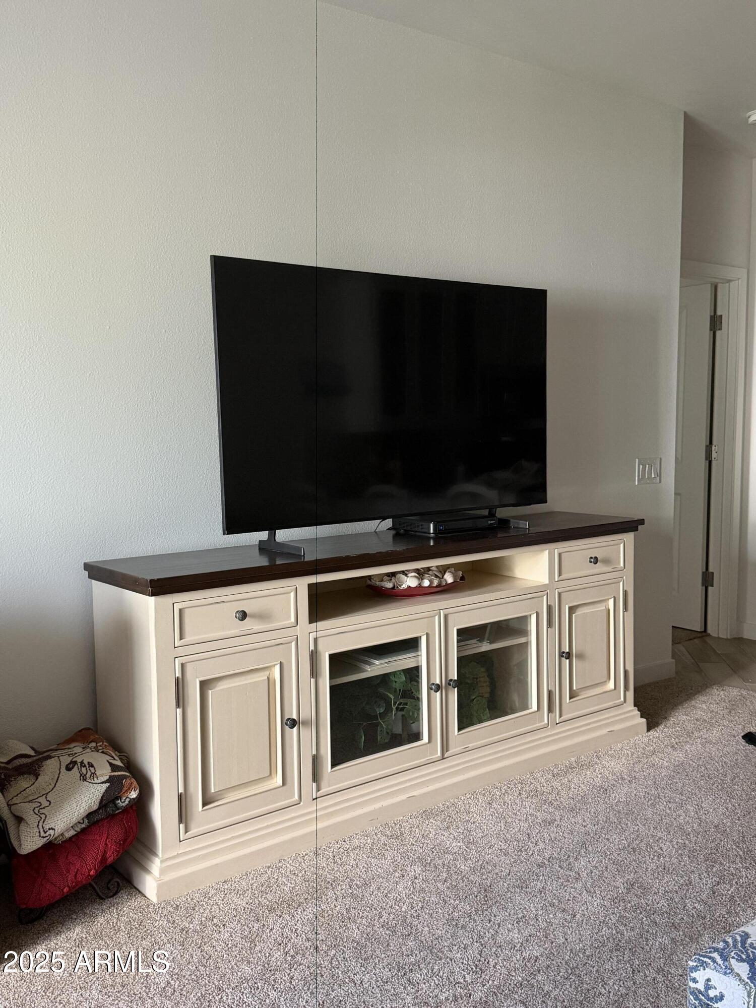 2511 West Queen Creek Road, Unit 223 Chandler, AZ 85248 - Photo 9 of 29 a living room with stainless steel appliances kitchen island a stove and a microwave