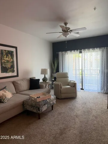 a living room with furniture and a couch
