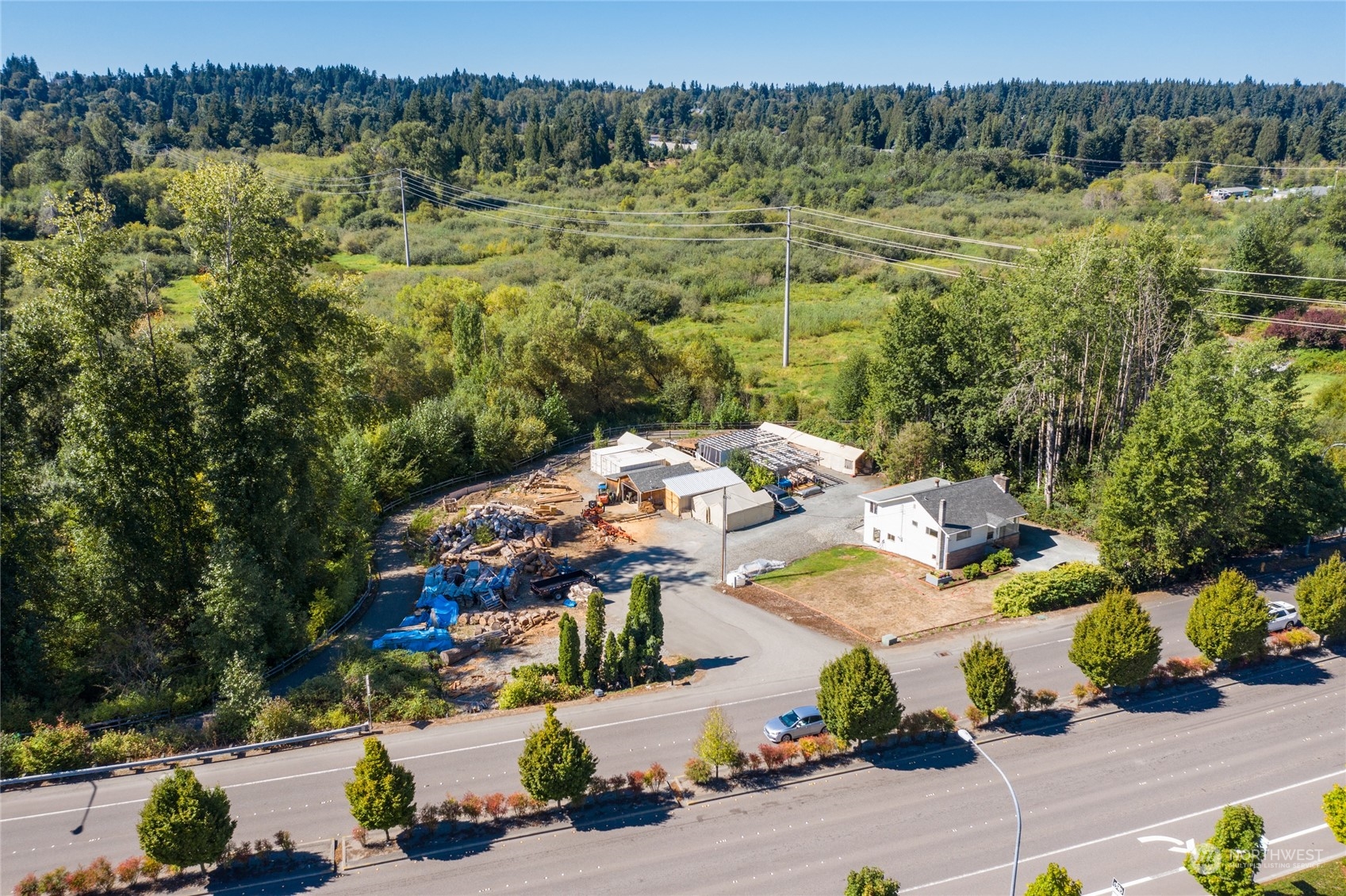 an aerial view of a house with a yard