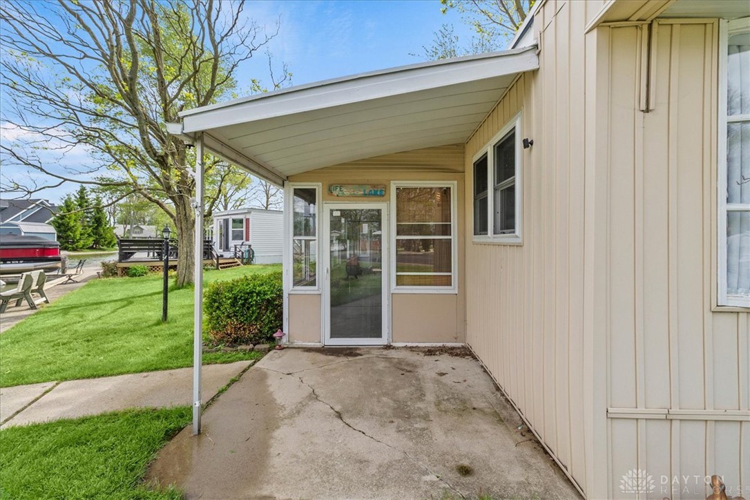 246 North Orchard Island Road Russells Point, OH 43348 - Photo 5 of 43 This charming residence features an inviting covered patio, perfect for enjoying the outdoors.