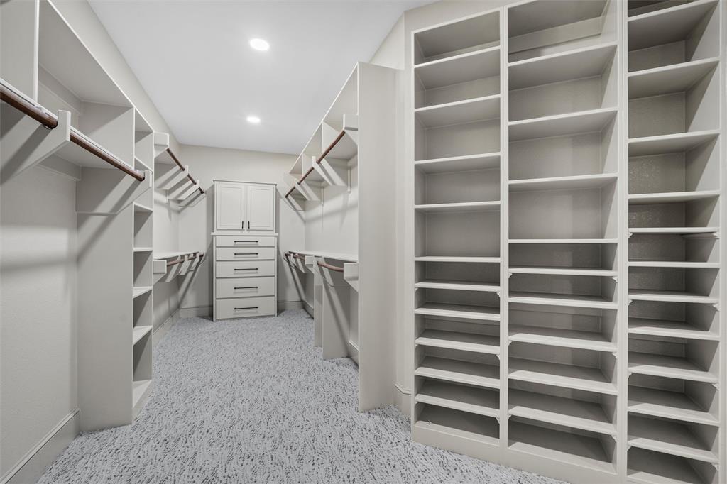 1925 Manor Way Drive Mansfield, TX 76063 - Photo 24 of 40 a view of walk in closet with empty racks