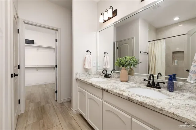 a bathroom with sink and mirror