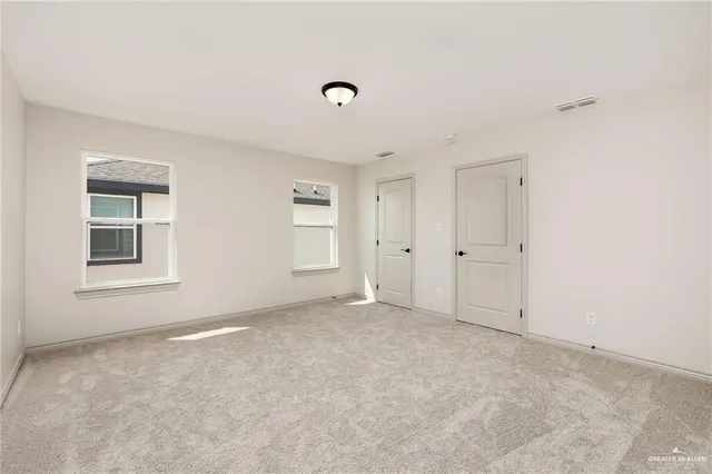 an empty room with windows