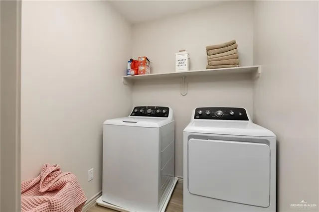 a utility room with dryer and washer