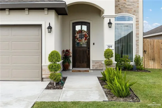front view of a house with a yard