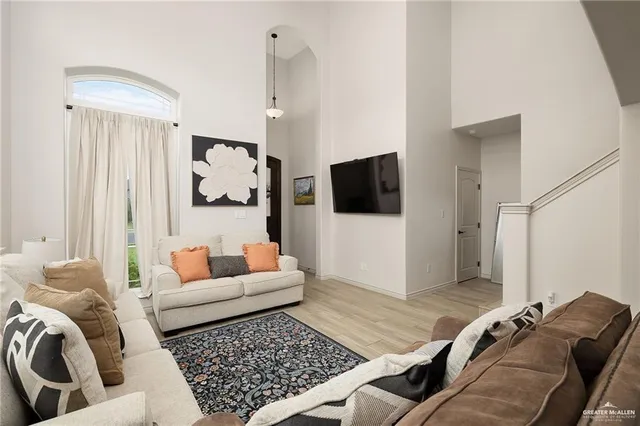 a living room with furniture and a rug