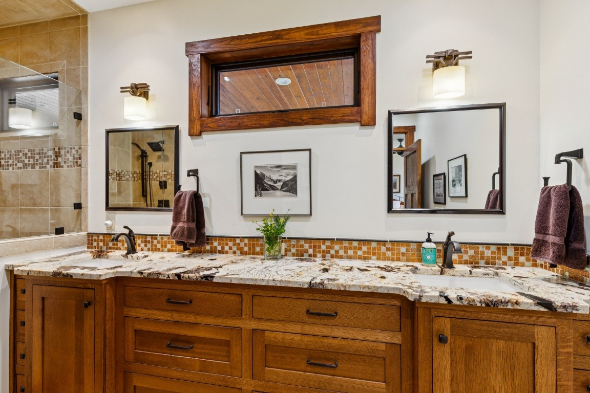394 Myers Point Road Sewanee, TN 37375 - Photo 19 of 44 a bathroom with a granite countertop sink and a mirror