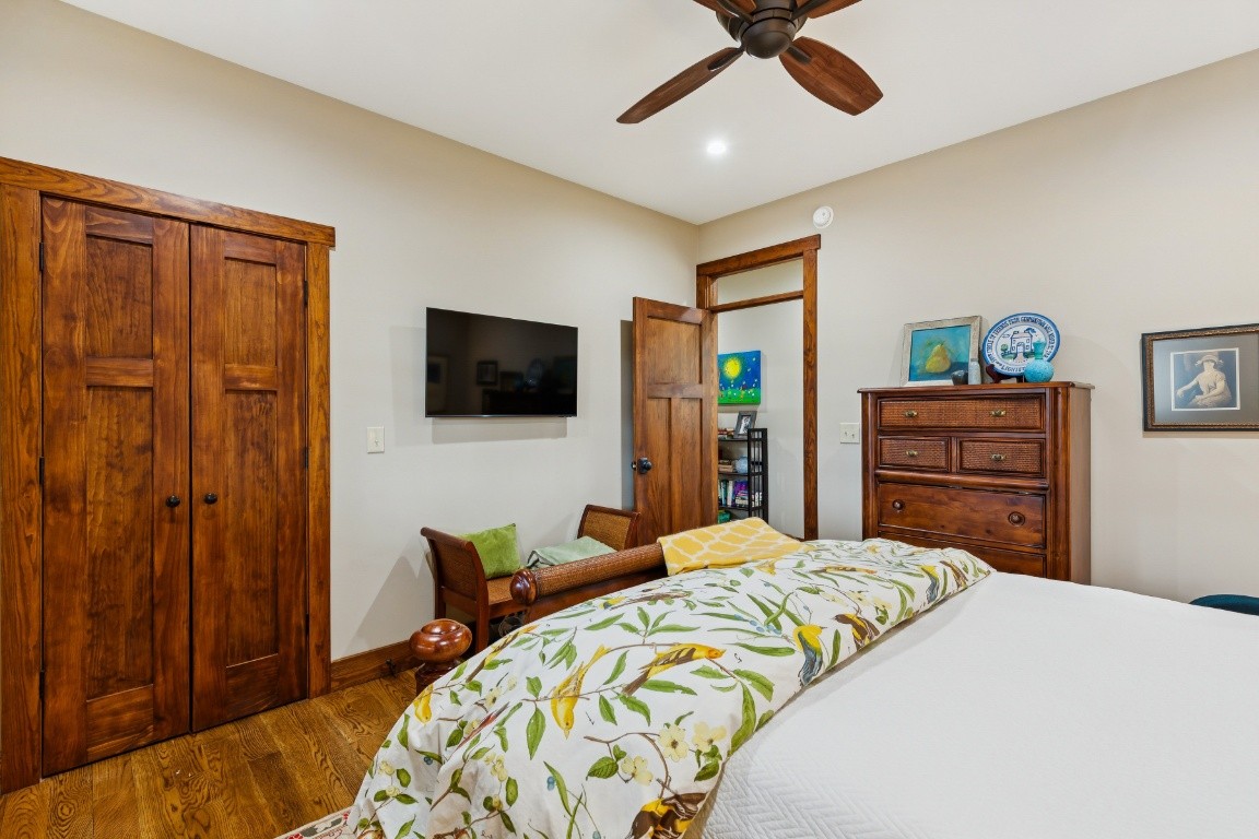 394 Myers Point Road Sewanee, TN 37375 - Photo 25 of 44 a bedroom with a bed and a flat screen tv