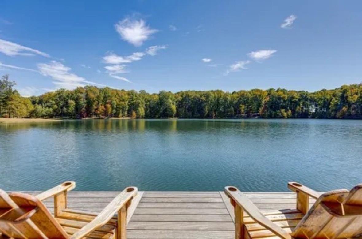 394 Myers Point Road Sewanee, TN 37375 - Photo 39 of 44 a view of a lake with couches chairs