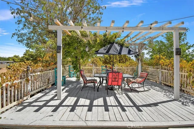 a view of a chairs and table on the terrace
