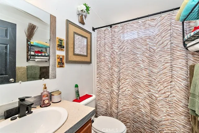 a utility room with fridge dryer and washer