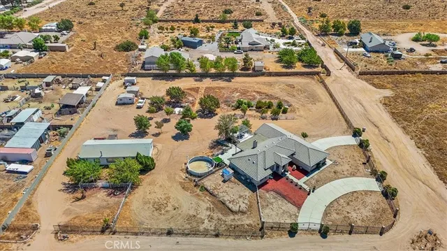 an aerial view of a house with outdoor space
