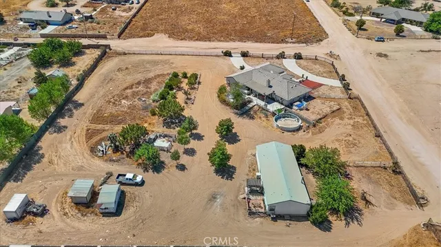 a view of a swimming pool with lounge chairs in patio