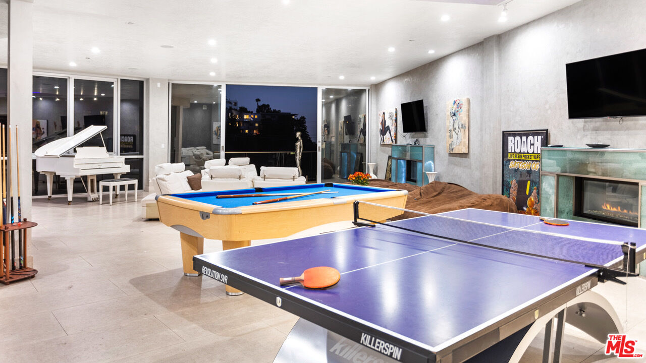 6425 Weidlake Drive Los Angeles, CA 90068 - Photo 13 of 37 a room with furniture pool table flat screen tv and windows