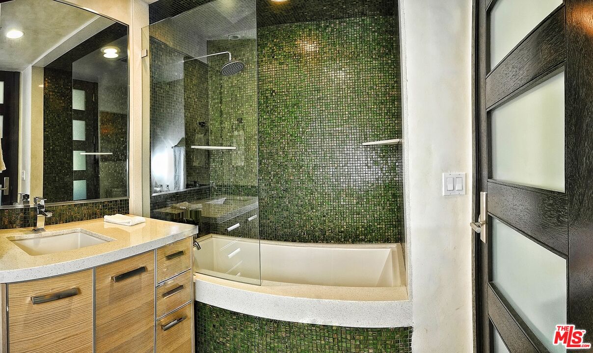6425 Weidlake Drive Los Angeles, CA 90068 - Photo 22 of 37 a bathroom with a bathtub and a sink