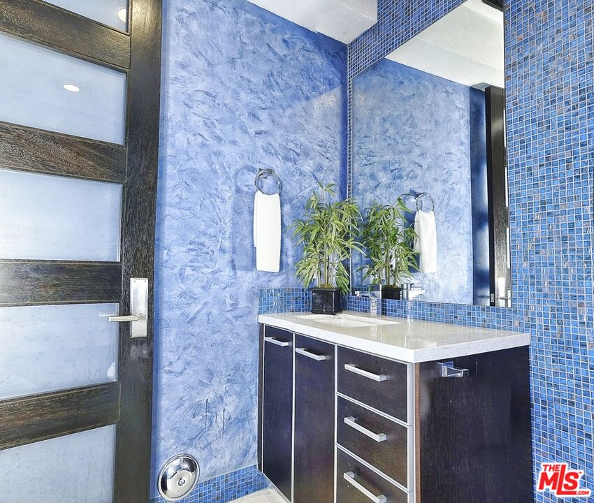 6425 Weidlake Drive Los Angeles, CA 90068 - Photo 29 of 37 a bathroom with a sink and a mirror