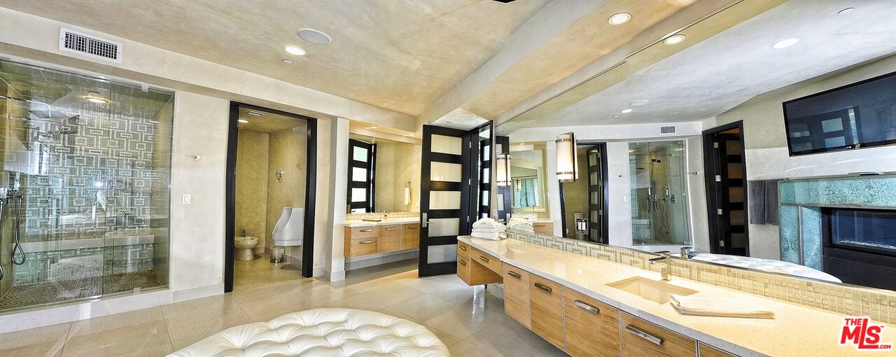 6425 Weidlake Drive Los Angeles, CA 90068 - Photo 32 of 37 a large spacious bathroom with a large tub and shower