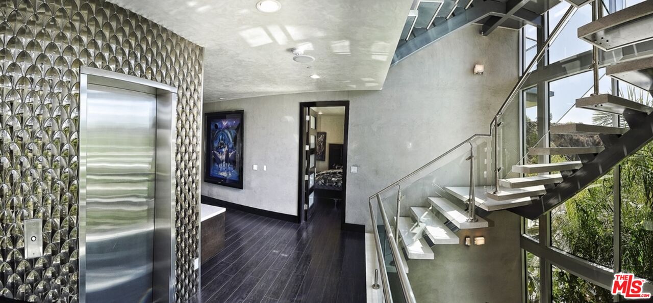 6425 Weidlake Drive Los Angeles, CA 90068 - Photo 33 of 37 a view of entryway and hall with wooden floor