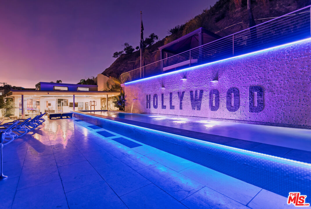 6425 Weidlake Drive Los Angeles, CA 90068 - Photo 5 of 37 a view of a swimming pool with an outdoor seating