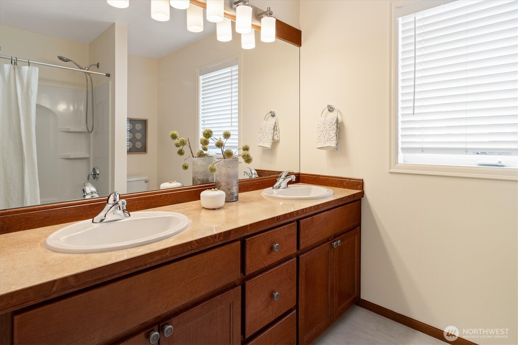 1206 South 36th Place Renton, WA 98055 - Photo 28 of 37 a bathroom with a sink double vanity and a mirror