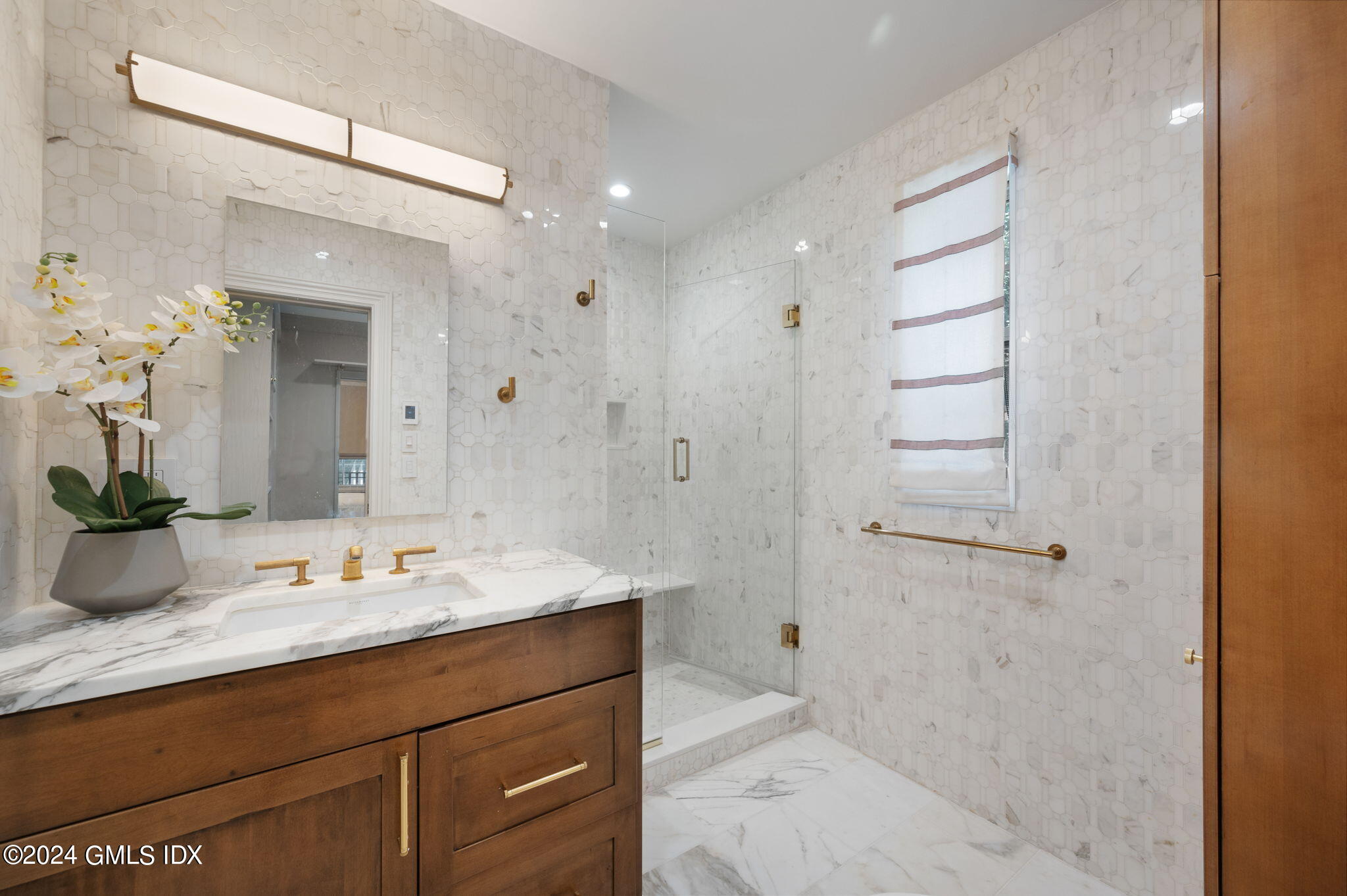 20 Church Street, Unit B11 Greenwich, CT 06830 - Photo 11 of 23 a bathroom with a sink shower and a mirror