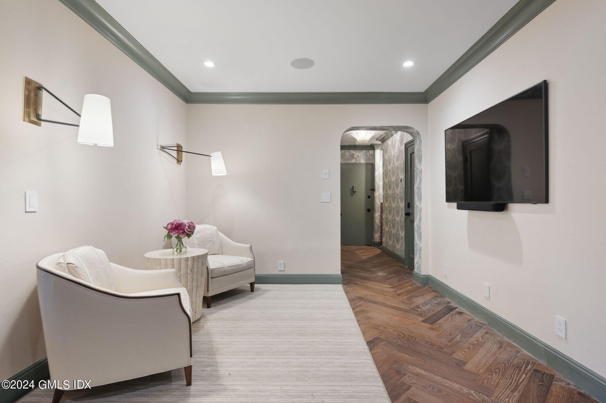 20 Church Street, Unit B11 Greenwich, CT 06830 - Photo 2 of 23 a hallway with a couch and mirror