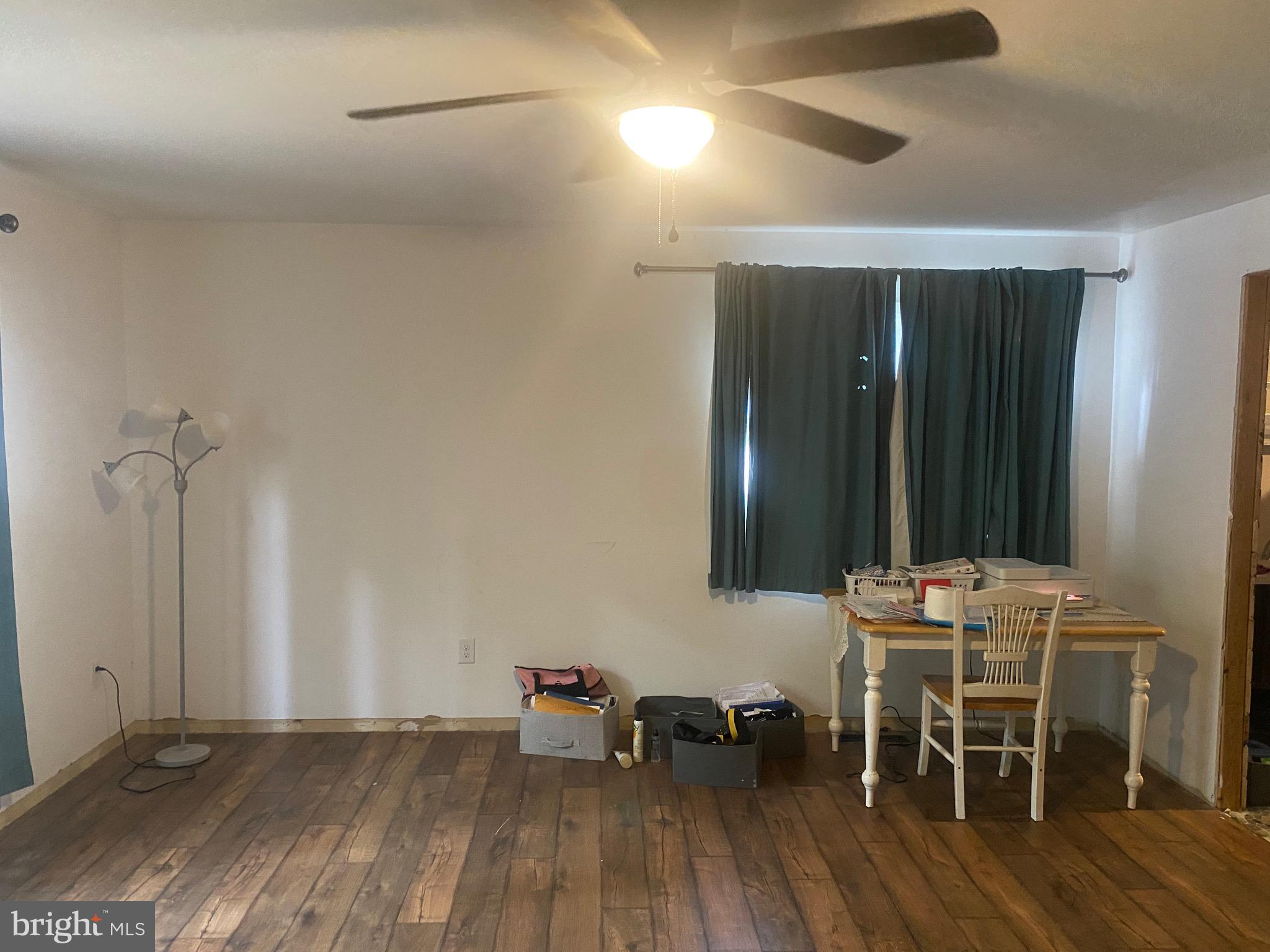 22502 Atlanta Road Seaford, DE 19973 - Photo 7 of 13 a dining room with furniture and wooden floor