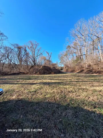 a view of a yard with an ocean view