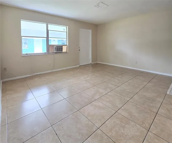 a kitchen with white cabinets a sink and white appliances