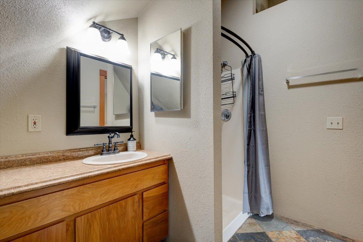 41622 Blue Oak Drive Springville, CA 93265 - Photo 30 of 68 a bathroom with a double vanity sink and mirror